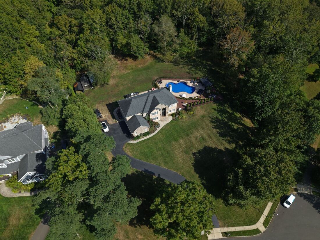 Fire Bowls + Cascading Waterfall pool in Central NJ &mdash; Seasonal World build with in-pool loungers