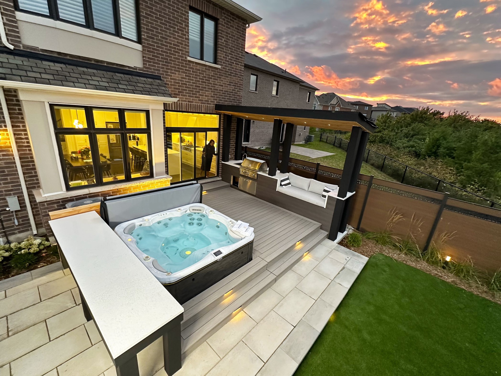 Seasonal World Hydropool self-cleaning hot tub at dusk &mdash; crystal-clear water with no scrubbing