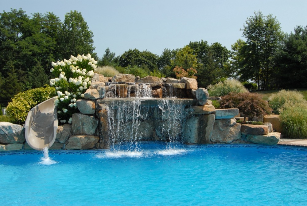 Custom inground gunite pool with rock waterfall