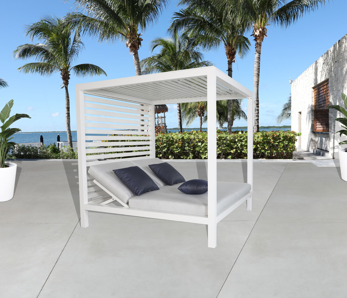 A modern outdoor cabana installed in a backyard setting at golden hour