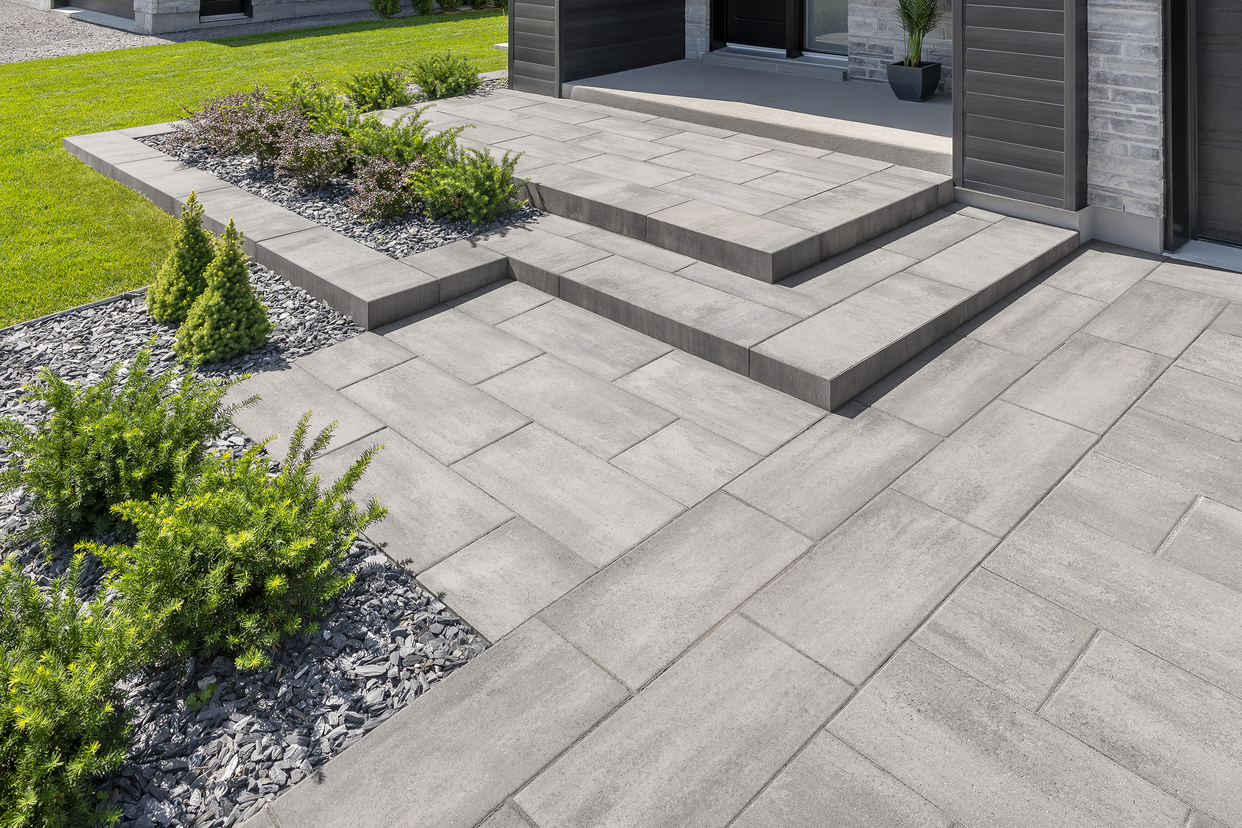 Rinox ORA Step rising from a PROMA XL paver patio in Husky