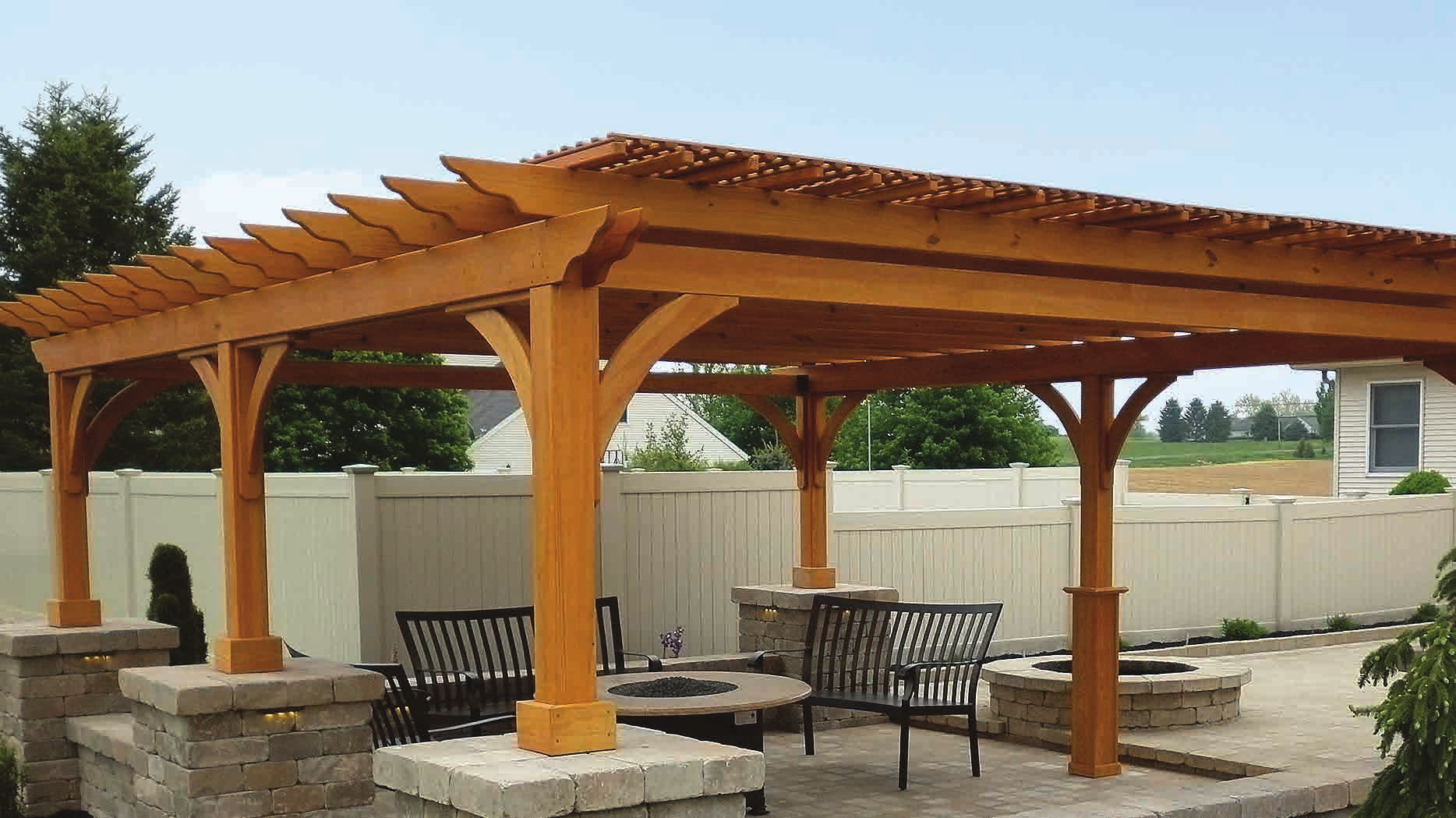 Homestead Structures Elegant Wood pergola with cinder stain in a backyard setting